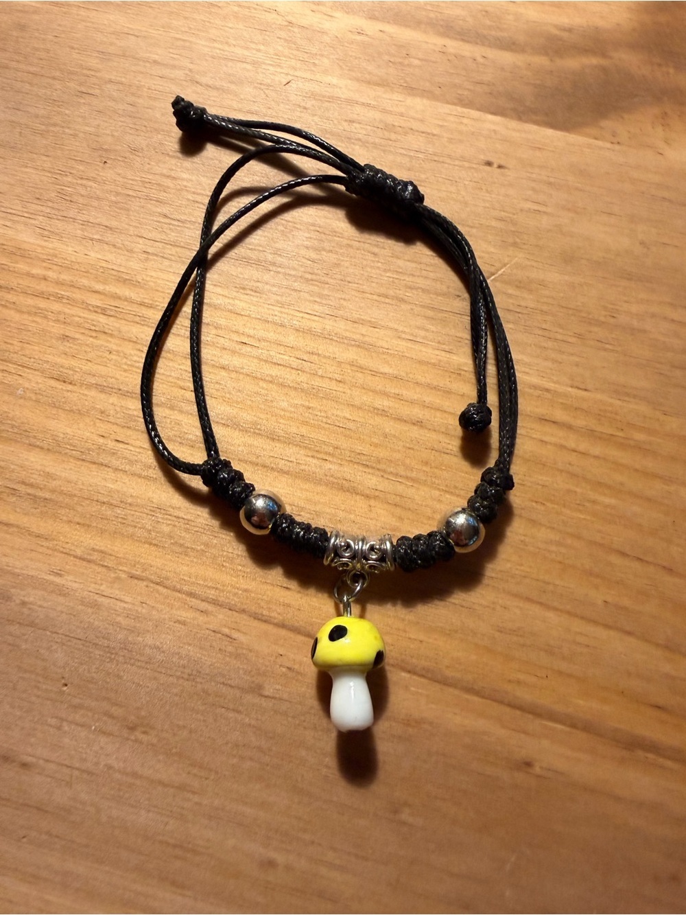 Adjustable Black Cord Bracelet with Yellow Mushroom Charm